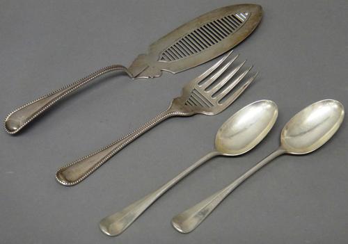 Silver, comprising; a pair of Victorian double struck, bead edged, Old English pattern fish servers, Exeter 1866 and a pair of rat tail pattern tables