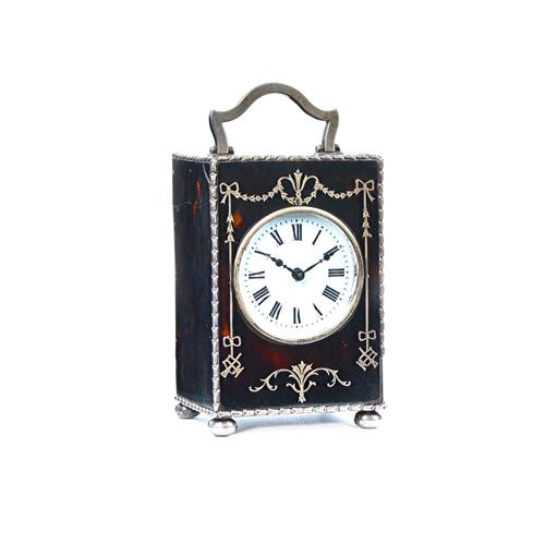 A silver mounted tortoiseshell rectangular cased carriage clock timepiece, the movement detailed to the backplate Made In France, the circular white e
