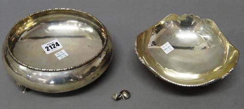 A circular bowl, having a decorated rim, detailed Silver J.K, (one of the three feet detached, but present) diameter 15cm and a trefoil shaped bowl, h