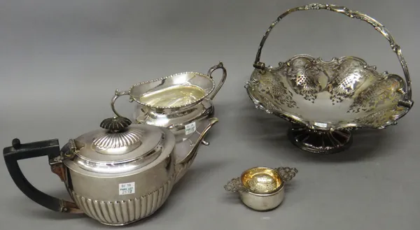 A silver twin handled tea strainer, with a bowl, Birmingham 1932, weight 62 gms and plated wares, comprising; a shaped circular cake basket, with pier