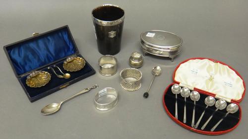 Silver and silver mounted wares, comprising; an oval hinge lidded trinket box, raised on four feet, Birmingham 1925, a set of six coffee spoons, Sheff