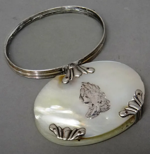 A silver and mother-of-pearl oval folding magnifying glass, the centre of the front decorated with the portrait of George II, otherwise with fanned mo