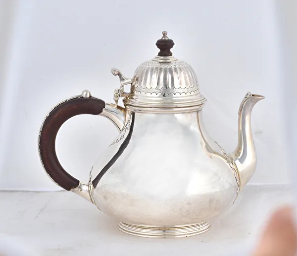 A silver four piece tea and hot chocolate/coffee set, comprising; a teapot, a hot chocolate/coffee pot, a twin handled sugar bowl and cover and a milk