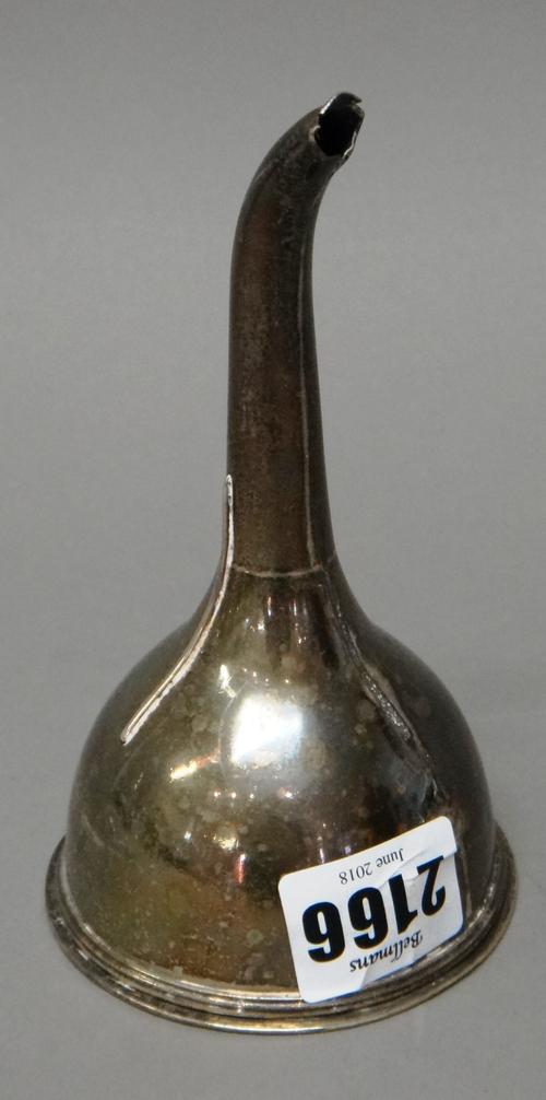An Irish silver wine funnel, Dublin possibly 1807, the drop-in strainer apparently unmarked and a late George II silver toddy ladle, the bowl of shape