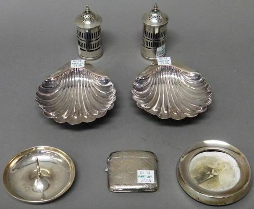 Silver and silver mounted wares, comprising; a pair of butter shells, each raised on three spherical feet, Sheffield 1911, a rectangular vesta case, a