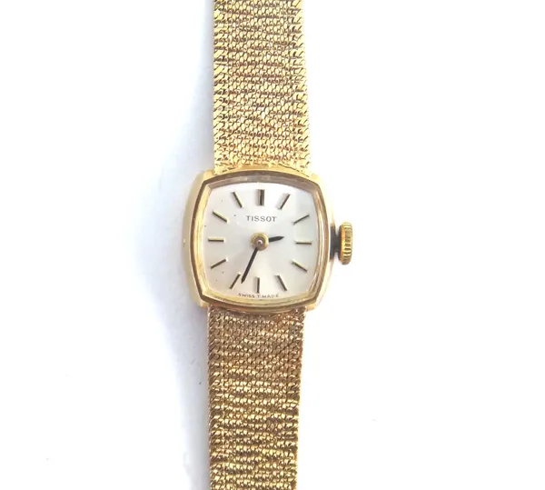 A Tissot 9ct gold lady's bracelet wristwatch, with a signed jewelled movement, the signed silvered dial with baton shaped numerals and with black hand