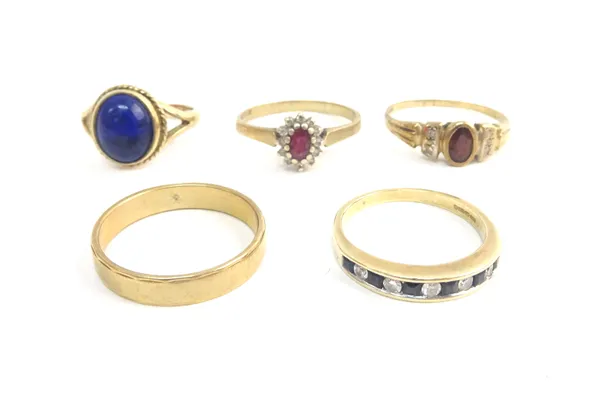 A 9ct gold ring, mounted with an oval lapis lazuli, a 9ct gold, sapphire and diamond eleven stone half eternity ring, two further gem set rings and a