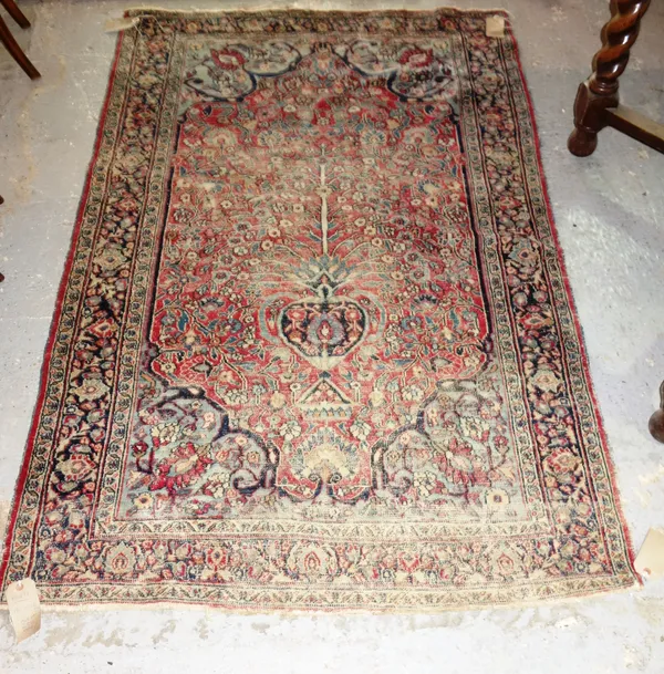 A Kerman rug with large ivory medallion, 248cm x 172cm, and a Meshed prayer rug, 190cm x 122cm, (2).  F7