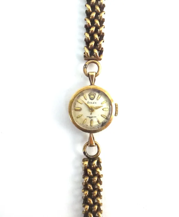 A Rolex Precision 9ct gold, circular cased lady's wristwatch, with a signed jewelled movement, the case London 1961, on an associated 9ct gold multipl