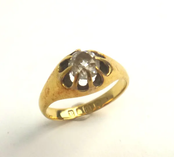 A late Victorian 18ct gold and diamond single stone ring, claw set with a cushion shaped diamond, London 1896, ring size M, with a case.