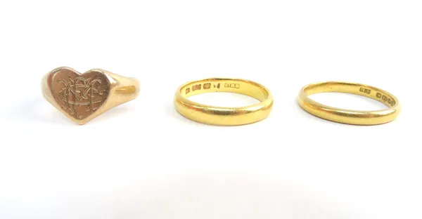 Two 22ct gold plain wedding rings, combined weight 6.5 gms and a 9ct gold heart shaped signet ring, monogram engraved, weight 2.8 gms, (3).