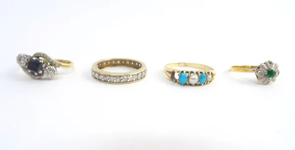 A gold and diamond set full eternity ring, mounted with circular cut diamonds, an 18ct gold and platinum, sapphire and diamond set three stone ring, i