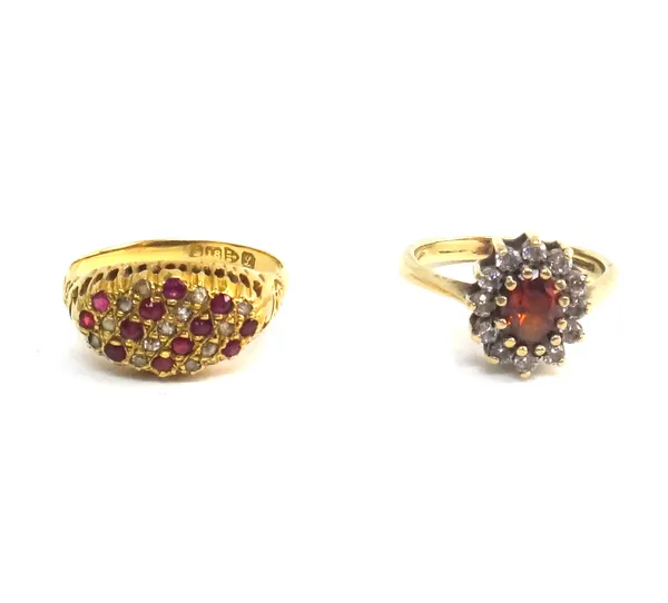 An 18ct gold, ruby and diamond ring, mounted with rows of rubies, alternating with rows of diamonds, in an oval design, Chester 1911, ring size R and