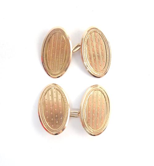 A pair of 9ct gold oval cufflinks, with engine turned decoration, Birmingham 1938, with a later case, weight 6.2 gms.