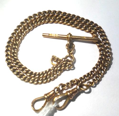 A gentleman's 9ct gold graduated curb link watch Albert chain, fitted with a 9ct gold T bar and with two 9ct gold swivels, weight 19.5 gms.