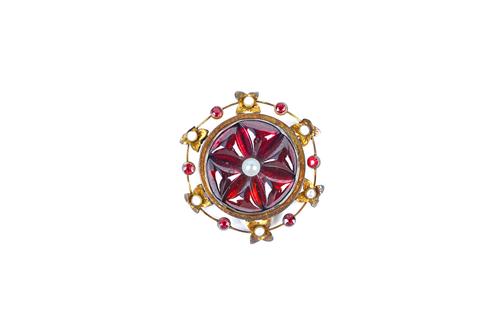 A gold, carbuncle garnet, cultured pearl and red gem set brooch, the centre mounted with six carbuncle garnets, centred by a single cultured pearl, wi