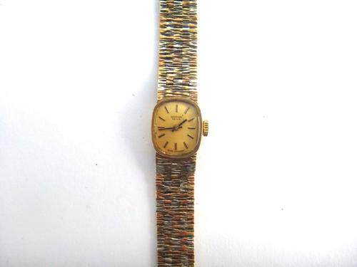 A Marvin Revue 9ct three colour gold lady's bracelet wristwatch, in a bark textured brick link design, with a foldover clasp, London 1979, gross weigh