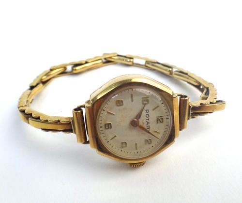 A Rotary 9ct gold cased lady's wristwatch, the signed circular silvered dial with gilt Arabic and hyphen numerals, on an expanding bar link bracelet,