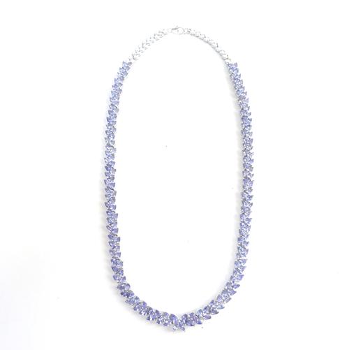 A silver and tanzanite necklace, claw set with pear shaped and marquise cut tanzanites, the front with a butterfly shaped motif, a silver and tanzanit