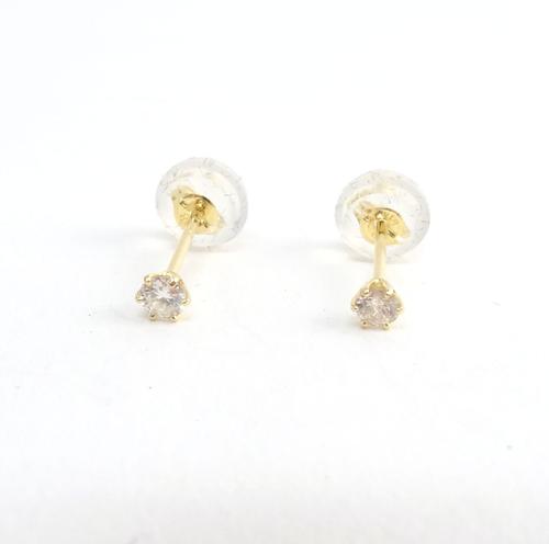 A pair of gold and diamond single stone earstuds, each claw set with a circular cut diamond, detailed K 18 0.05, with a box.