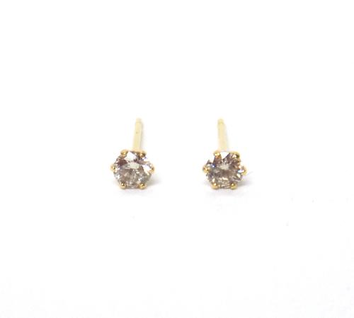 A pair of gold and diamond single stone earstuds, each claw set with a circular cut diamond, detailed K 18 0.10, with a box.