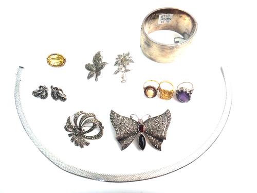 A 9ct gold, garnet and shell cameo ring, carved as the portrait of a lady, with a case, a gold and citrine single stone ring, a gold and citrine singl