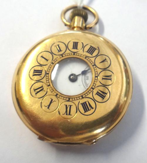 A lady's gold cased, keyless wind, half hunting cased fob watch, with a gilt jewelled lever movement, the inner and outer case detailed 18 K, the enam