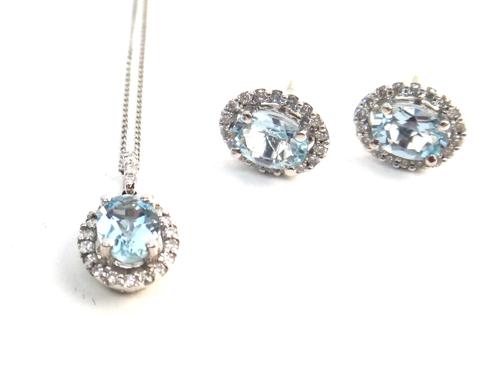 A pair of 18ct white gold, aquamarine and diamond oval cluster earstuds, each claw set with an oval cut aquamarine in an openwork surround, set with c