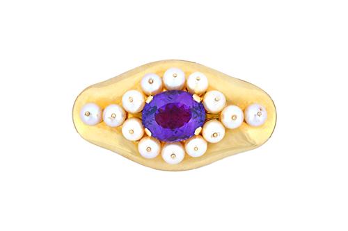 A gold, amethyst and cultured pearl brooch, of shaped oval form, claw set with the oval cut amethyst to the centre, in a surround of large cultured pe