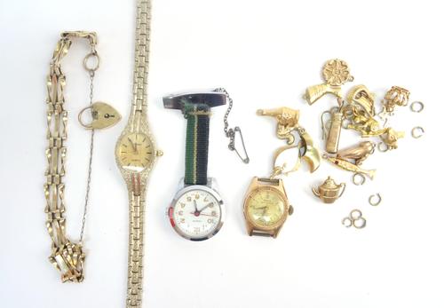 A 9ct gold gatelink bracelet, with a heart shaped padlock clasp, fifteen mostly 9ct gold charms, including; two fish, a Viking ship, a crown and a tea