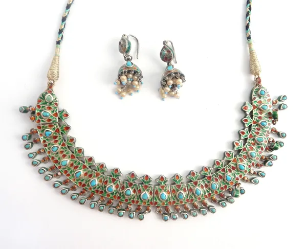 An Indian turquoise set and varicoloured enamelled articulating fringe necklace, on a blue, black and gold woven cord, together with a pair of Indian