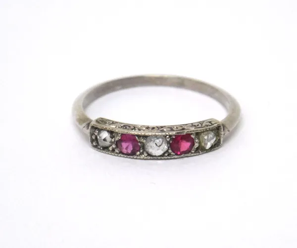 A ruby and diamond five stone ring, mounted with two cushion shaped rubies, alternating with three variously cut diamonds, ring size M.