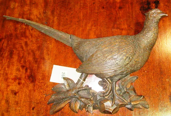 A 20th century carved wooden wall plaque of a pheasant, 56cm widest.  B4