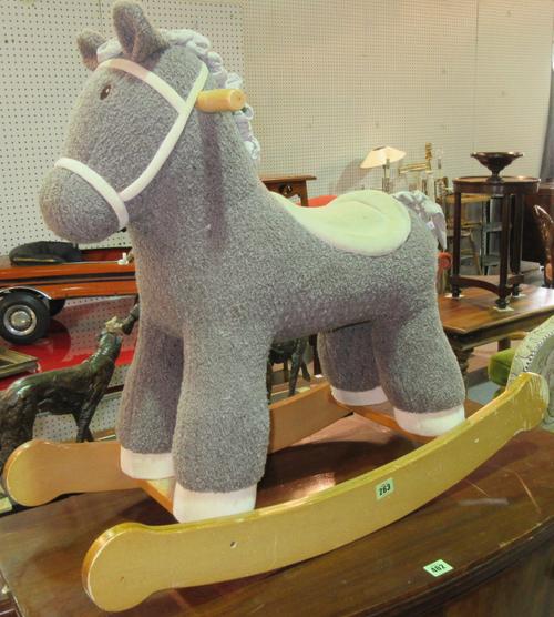 Little Bird Told Me; Bramble, a child's soft material rocking horse, with faux suede saddle and bridle on wooden frame, seat height 44cm. D5