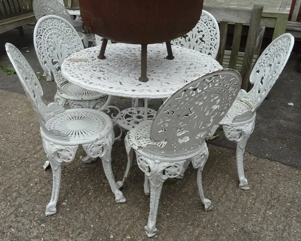 A 20th century white painted metal garden table and six chairs, 91cm diameter, (7). OUT