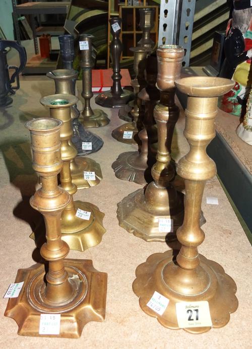 Collectables, including; a group of eleven 18th century and later bronze and brass mixed petal based candlesticks, (11).   S3M