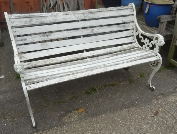 A 20th century white painted metal and wooden garden bench, 130cm wide. OUT