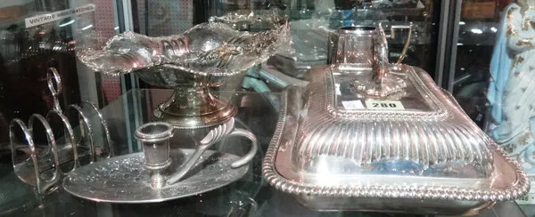 Silver plated wares, including; a fruit bowl of wavy form, jug, toast rack, chamber stick, tureen and cover, (qty).   CAB