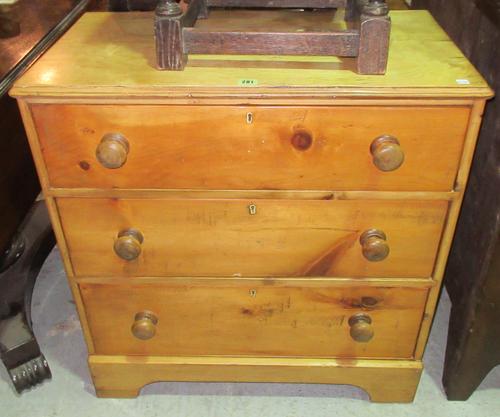 An early 20th century pine chest of three long drawers, on bracket feet with bun handles, 77cm wide x 80cm high. E8