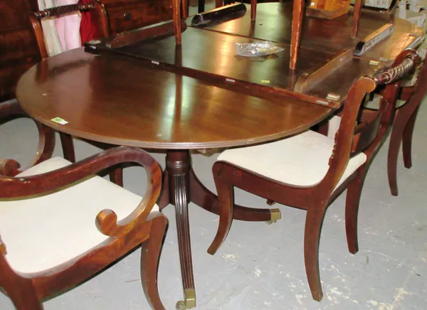 A Regency style mahogany twin pillar 'D' end extending dining table, with two extra leaves, 112cm wide x 166cm long, 276cm long fully extended.  H6