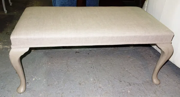 A 20th century rectangular footstool, the calico upholstered overstuffed top on four grey painted cabriole supports, 112cm wide x 47cm high x 64cm dee