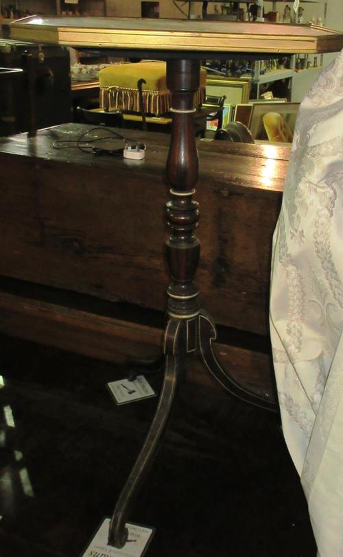An early 19th century occasional table, the brass bound canted rectangular top on a faux rosewood painted tripod base, 48cm wide x 78cm high. H6
