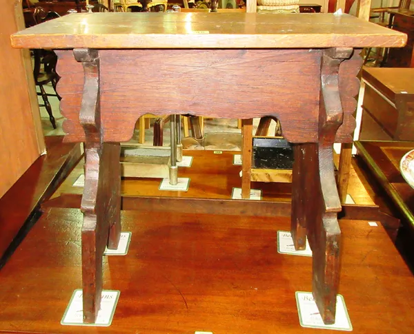 An early 18th century style oak stool, 56cm wide x 52cm high, and a 20th century carved mahogany two tier occasional table, 41cm wide x 62cm high, (2)