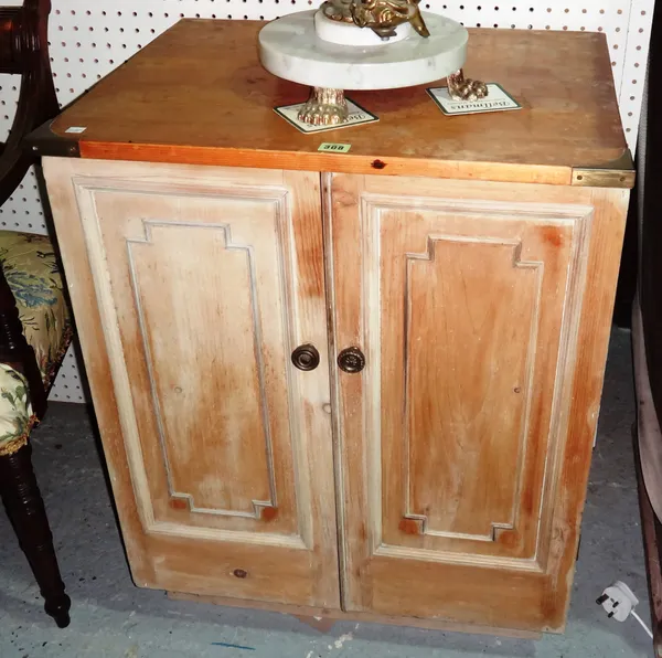 An early 20th century pine two door side cabinet, with panelled doors, 67cm wide x 81cm high.  G9