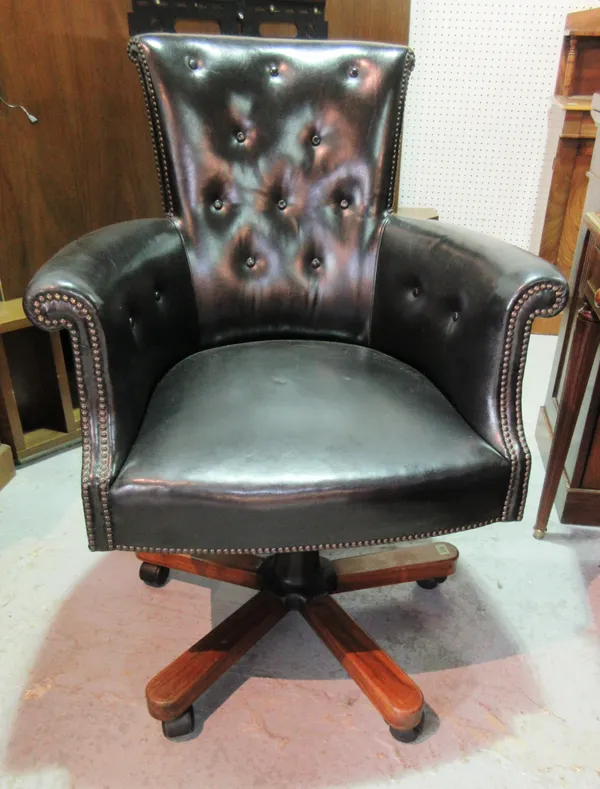 A 20th century black leather adjustable office chair.  B8