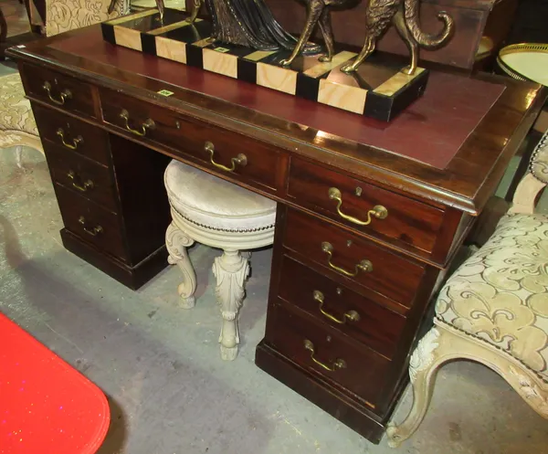 A 20th century mahogany pedestal desk, with red leather top, 122cm wide x 68cm high. C5