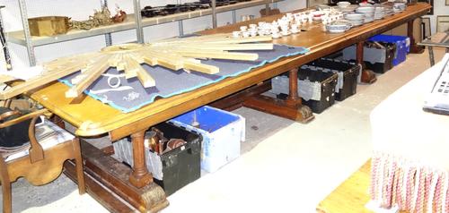 A large Victorian oak library table on fluted column supports, approximately 180cms wide, 605cms long (a.f).  BAY 3