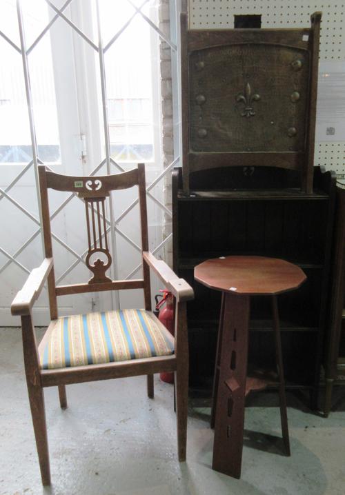 A group of 20th century oak Art Nouveau furniture, comprising; an open armchair, an octagonal side table (38cm wide x 76cm high), a brass fire screen