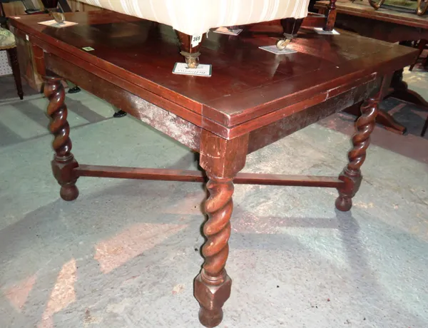 A 20th century oak draw leaf dining table on barleytwist supports, 108cm wide x 76cm high, and another 20th century oak draw leaf dining table, 80cm w