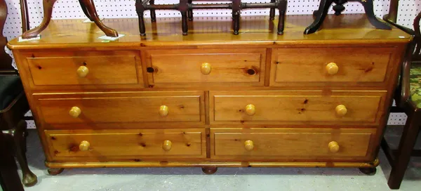 A 20th century pine sideboard with three short and four long drawers, 172cm wide x 72cm high.  D9